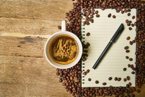Coffee and Notebook with Pen