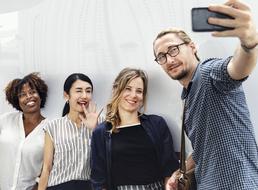student team is taking selfie
