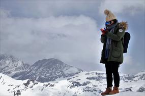 hiking woman in snowy mountains
