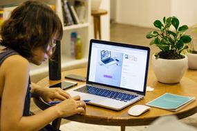 Woman working with the laptop in the office