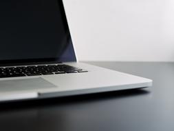 laptop on a black table