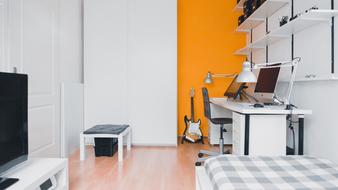 white and orange teen room