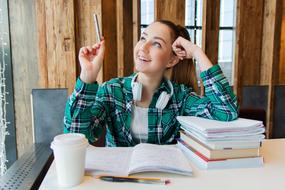 student dreamily looks at the window