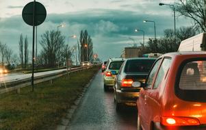 Colorful landscape with the cars on the road