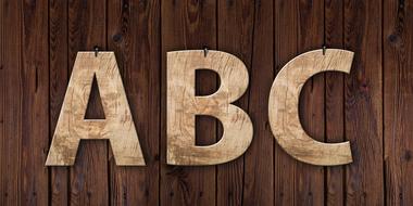 3d "ABC" letters on the wooden background