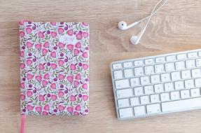 pink book and keyboard