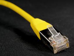 yellow network cable on the surface