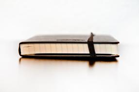 closed brown Notebook, Side View