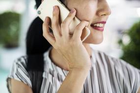 Asian girl talking on cell phone