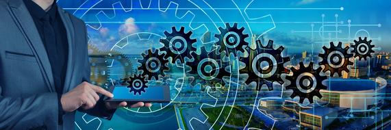 Man in suit, using tablet, and gears, at colorful background with the city, clipart