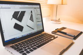 Apple Computer and graphics tablet on desk