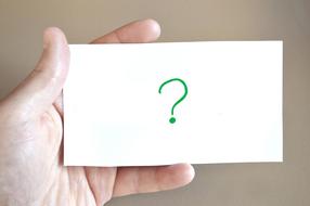 Question Mark on card in Hand