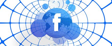 worldwide social network, facebook symbol over globe