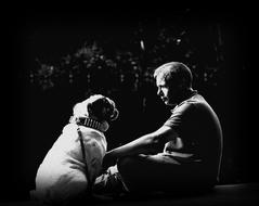 Black and white photo of the Friendship, man and Bulldog sitting together