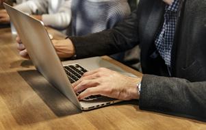 man works with laptop