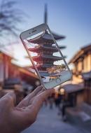temple in the iPhone screen in hand