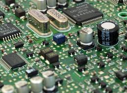 macro photo of transistors on an electronic board