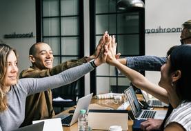 Agreement, young people with high five gesture in office