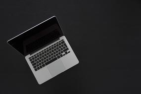 aerial photo of a laptop on a black background