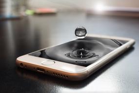 abstract photo drops a drop of water on the smartphone screen