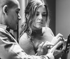 black and white photos of friends with a smartphone in their hands