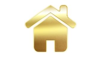Shining gold house icon at white background