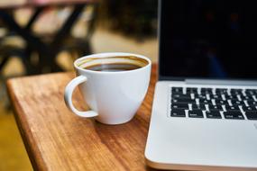 Coffee and laptop wood table