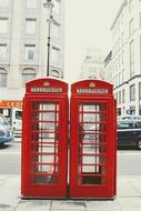 two red telephone boxes in London, England