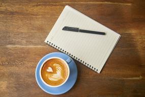 Coffee Blue cup and paper pen