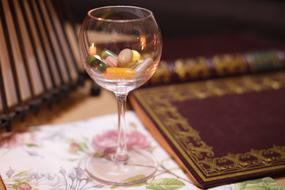 colorful Pills in wine glass