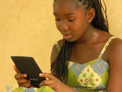 Girl Mali Reading phone
