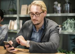 man chatting in smartphone