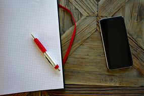 Smartphone Mobile Phone and red gold pen