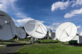 Satellite Technology Radio green grass blue sky