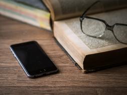 Phone Screen Technology and book and glasses