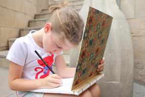 child Girl Drawing with pencil