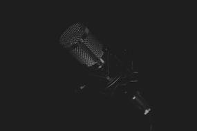 photo of vocal microphone in the dark