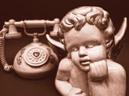 retro telephone and angel sculpture