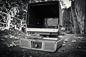 vintage computer on ground at abandoned Factory