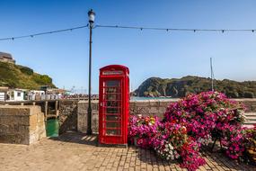 red phone booth on the coast