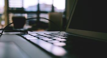 Home Office, Macbook on desk, soft focus