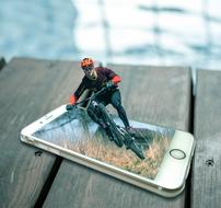 cyclist on the phone as 3d modeling