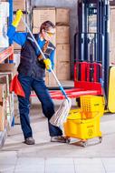 cleaner in work clothes at an industrial plant