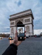 person Photographing Arc De Triomph with smartphone, france, Paris