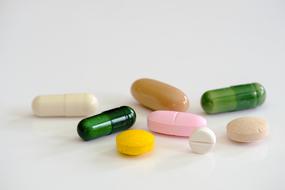 tablets of different sizes and shapes on a white surface