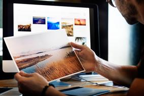 young man works with photographs