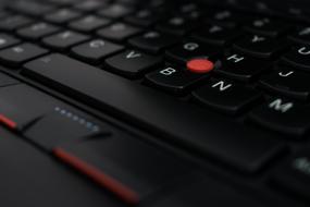 Beautiful, red, black and white laptop keyboard of "Lenovo" Thinkpad