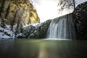 scenic waterfall in canyon at winter