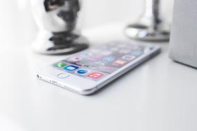 iPhone lies on a white table