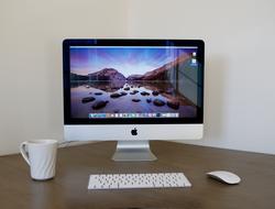 apple firm computer on desk in home office